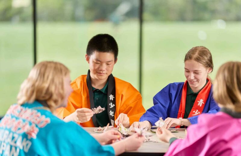 Teenagers from different cultures sharing experiences